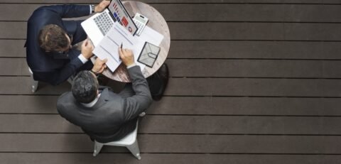 Two Businessmen Cafe Meeting Insurance Application Concept Two Businessmen Cafe Meeting Insurance Application Concept